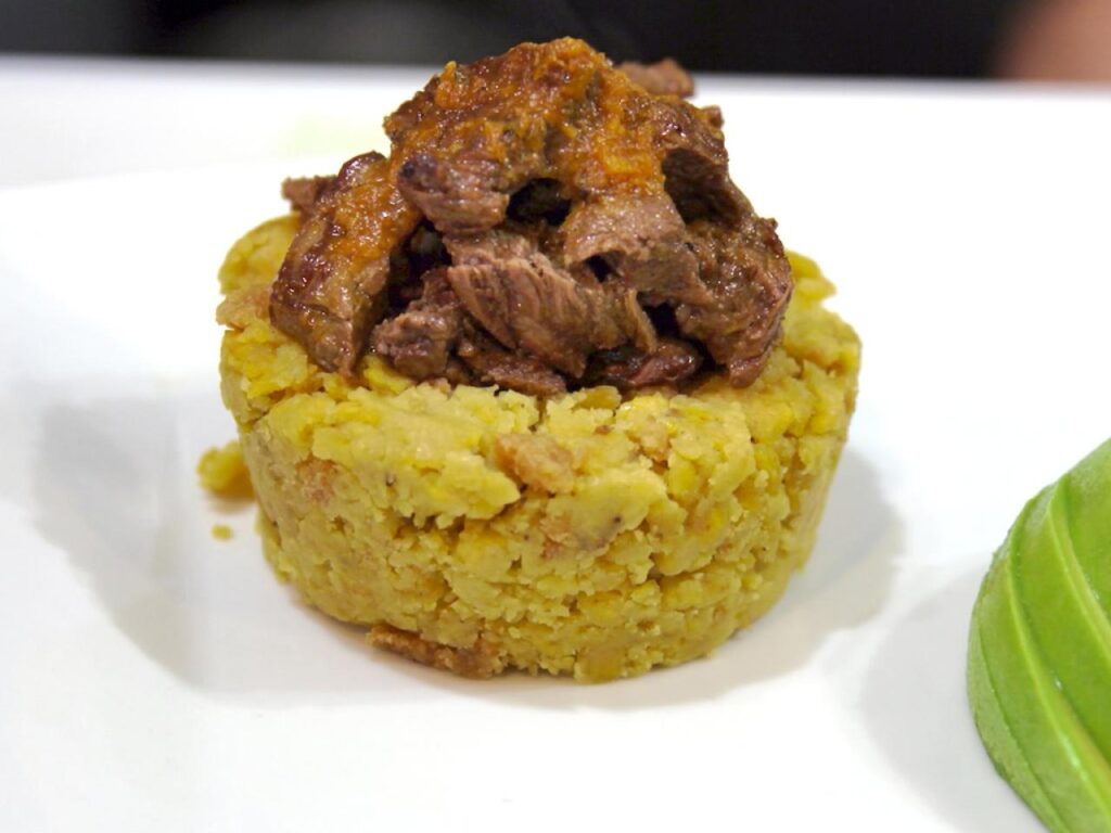 mix the beef into the Mofongo or serve it on top