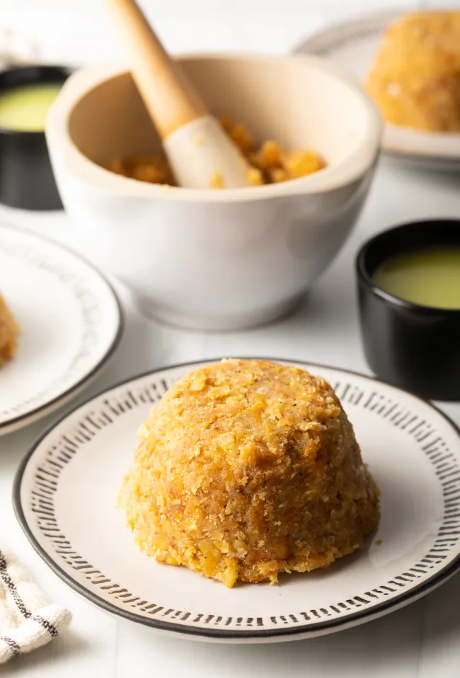 WHAT IS MOFONGO SERVED WITH?