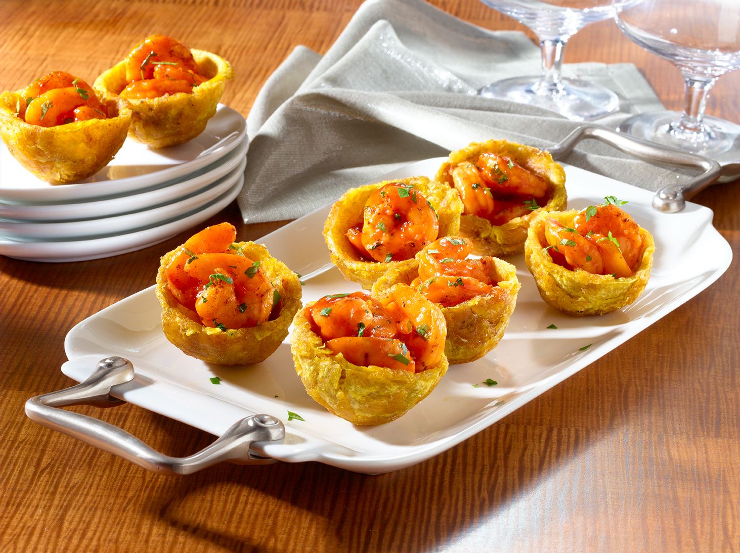 Assemble the Tostones Rellenos with seafood