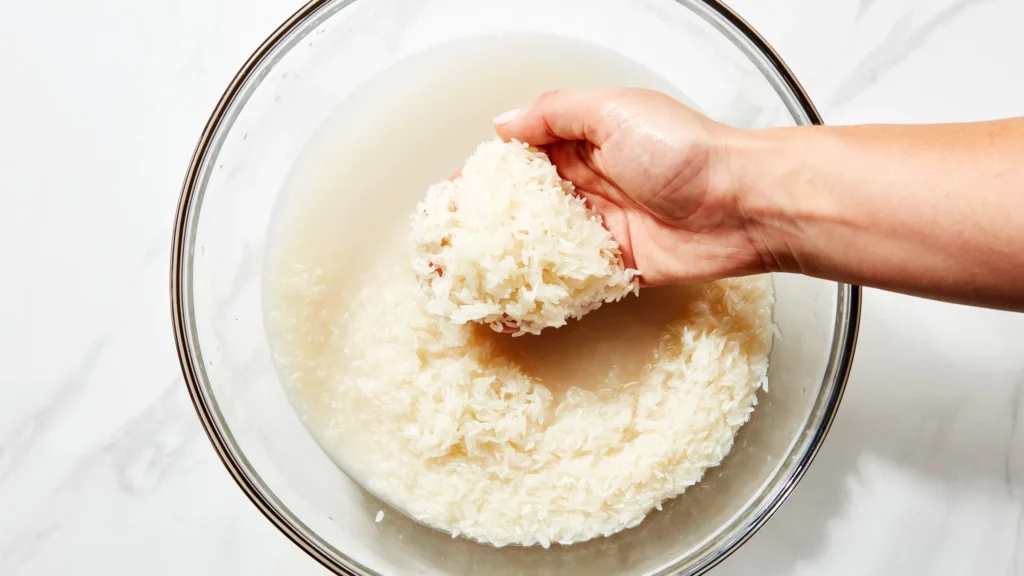 Rinse the rice until the water runs clear to remove excess starch, which causes stickiness.