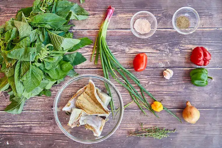 preparing the ingredients to cook callaloo"s soup