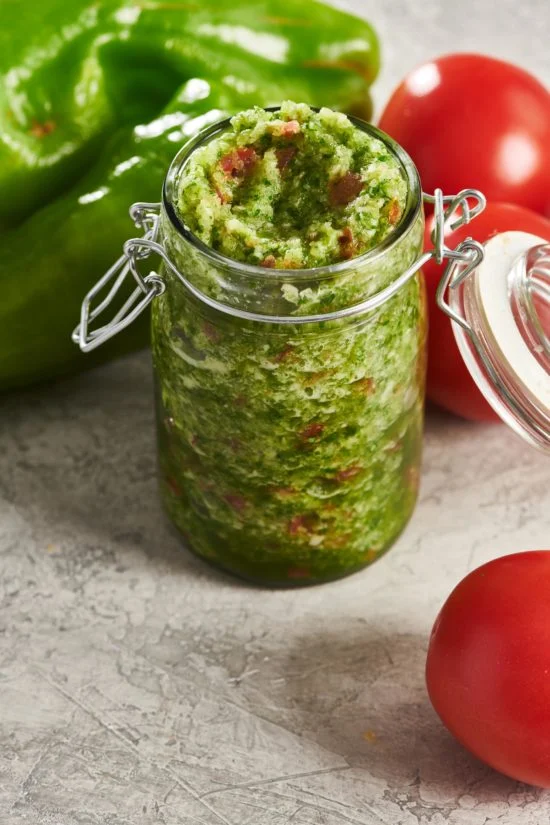 To keep your sofrito fresh, let it cool down after cooking. Then, put it in an airtight container. You can keep it in the fridge for up to a week. If you want it to last longer, freeze it. Use an ice cube tray to freeze portions of sofrito. Once they’re frozen, pop them out and store them in a freezer bag. This way, you can use a cube or two whenever you need them.