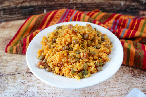 When it’s time for a special occasion like a wedding or anniversary, you can get creative with how you serve Arroz con Gandules. You might want to use a nice serving dish and place it in the centre of the table. You can also add some decorative elements like flowers or candles around the dish to make it look even more special.
