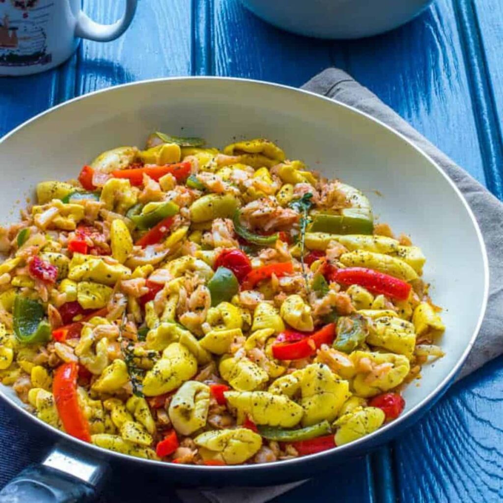 How are saltfish and ackee prepared Jamaican style?
