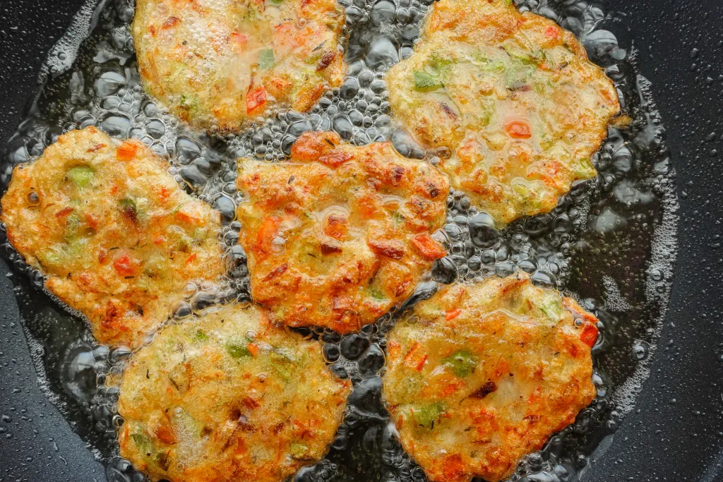 Frying the Codfish fritters