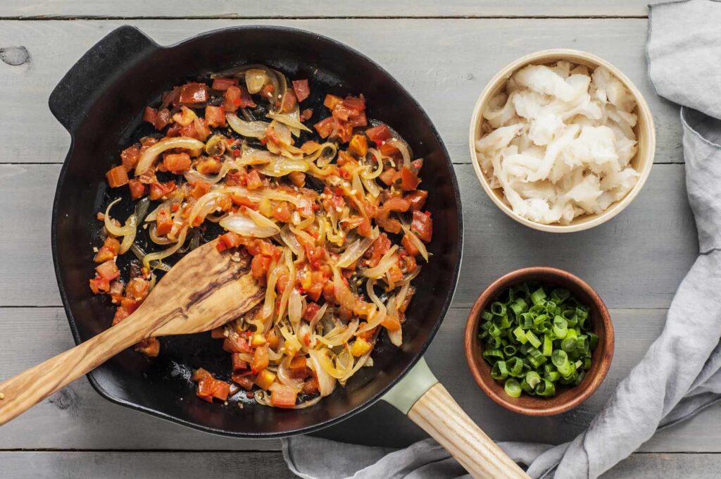 Sautéing the Aromatics Combine with Saltfish