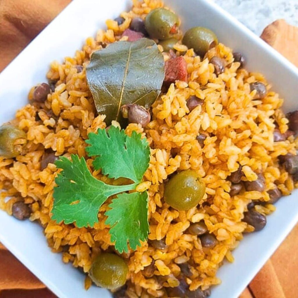 WHY DO PUERTO RICANS EAT ARROZ CON GANDULES?