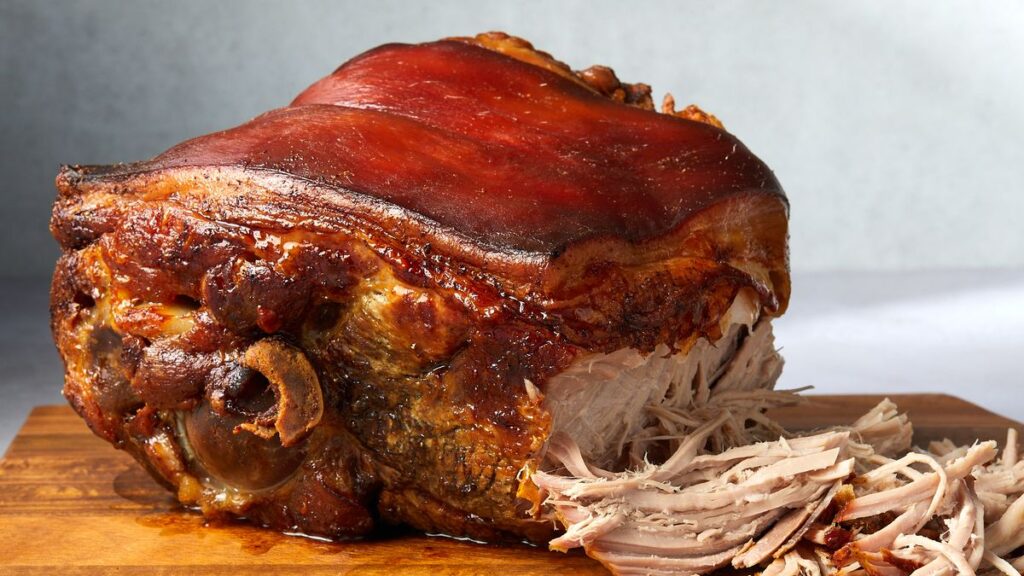 Pernil is a festive and flavorful roasted pork shoulder