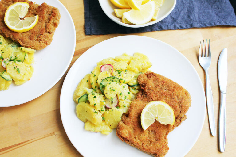 Soy milanesa served with mashed potatoes and salad.